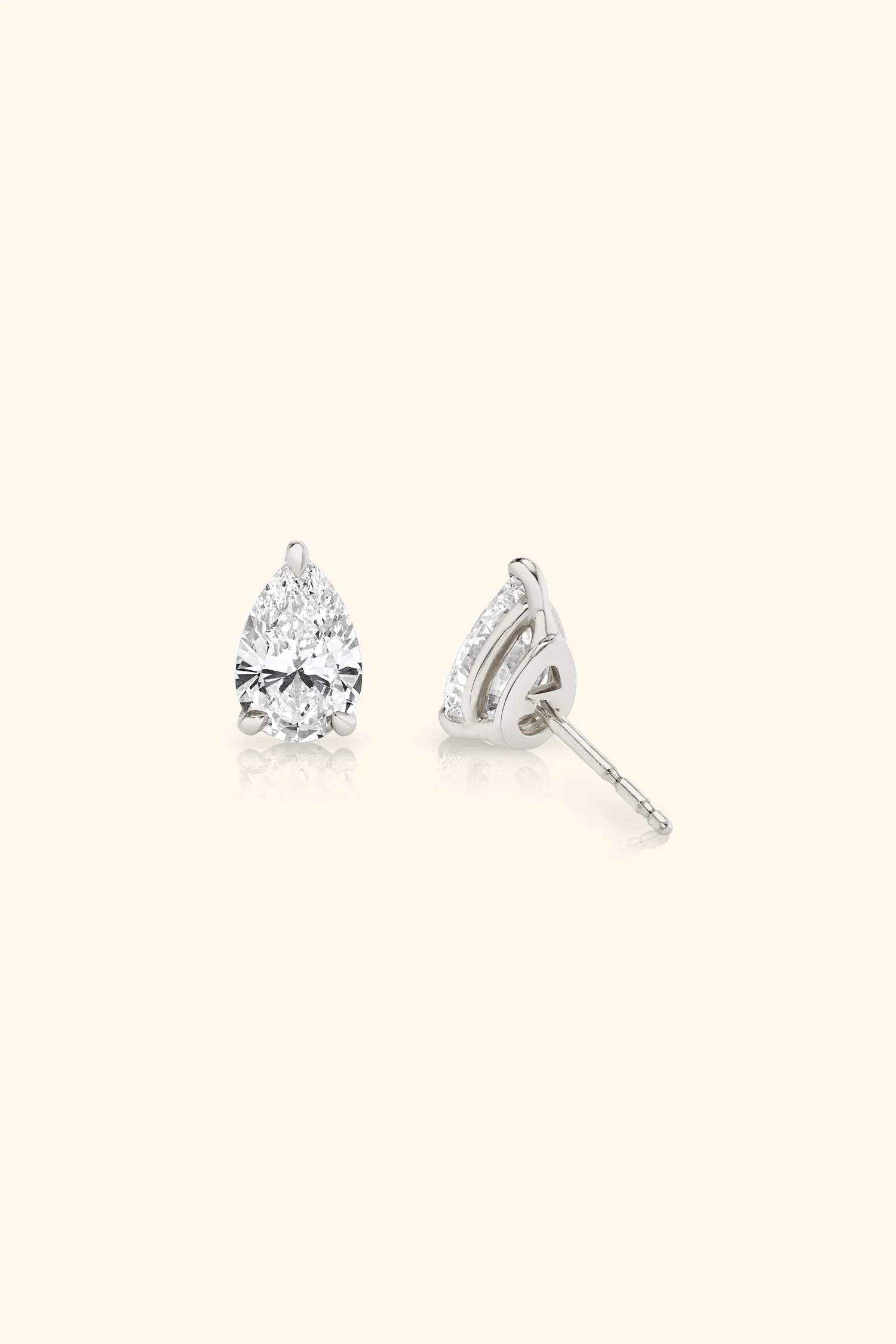 Classic Diamond Studs set with Pear Solitaire - Image 5