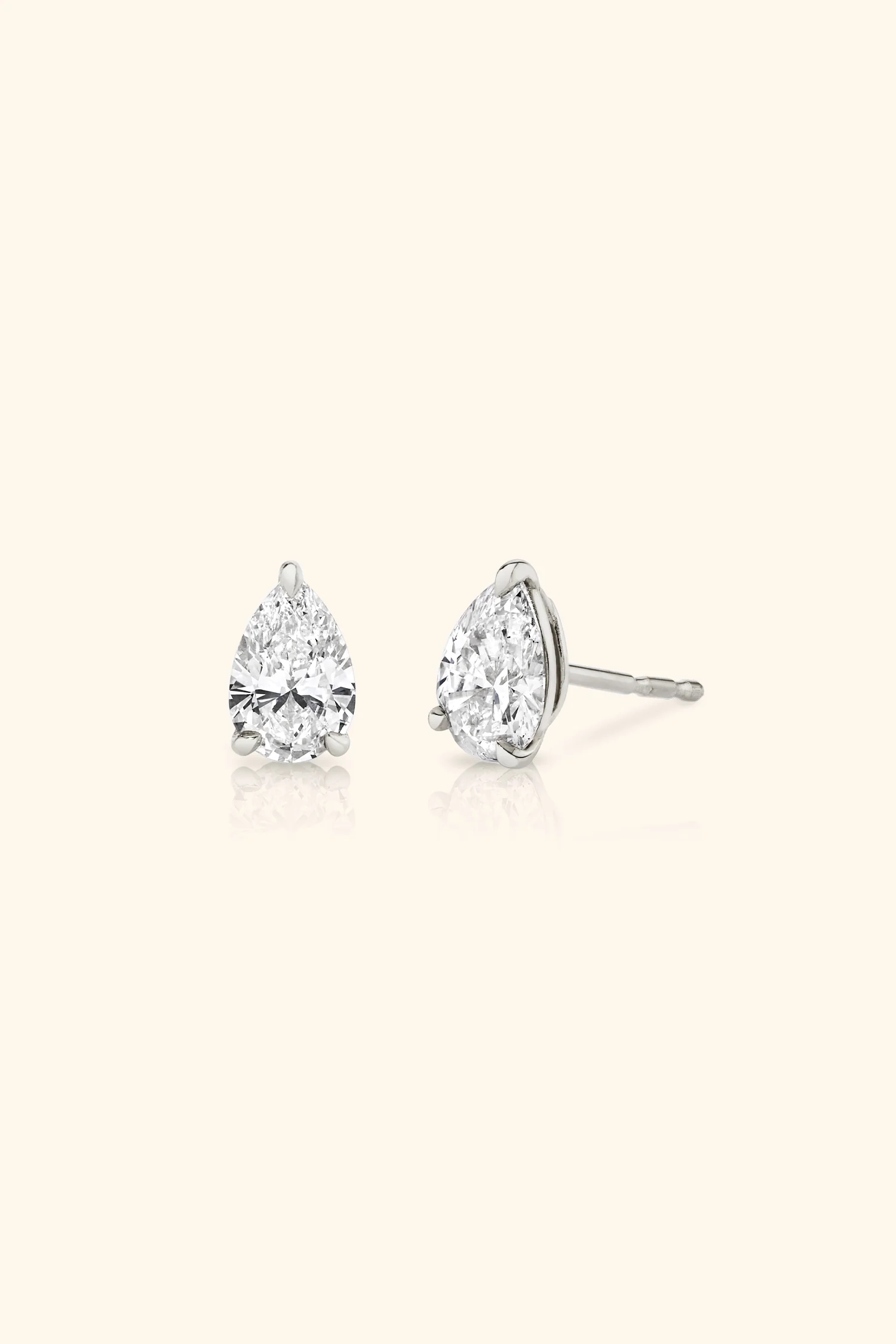 Classic Diamond Studs set with Pear Solitaire - Image 7